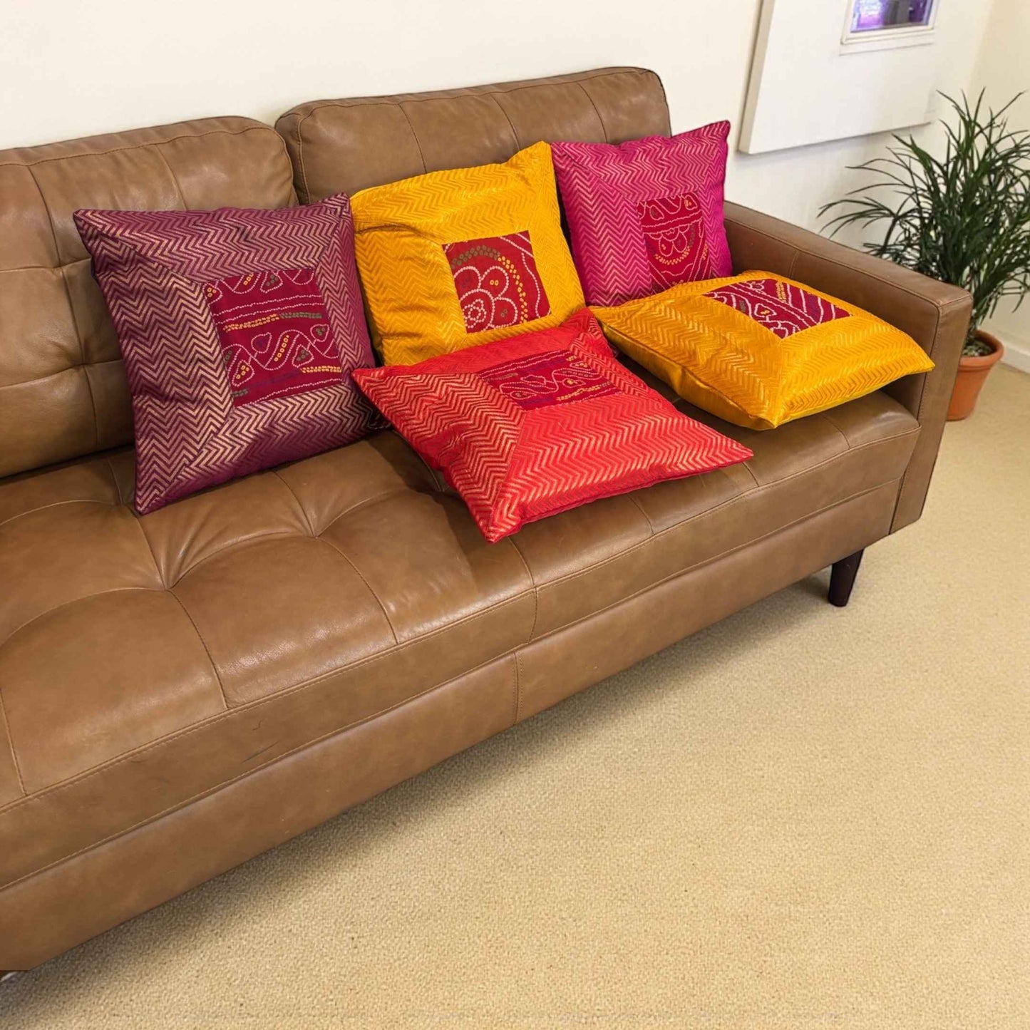 Boho living room with 5-piece Bandhani silk brocade cushion cover set (16×16) — vibrant Diwali home decor