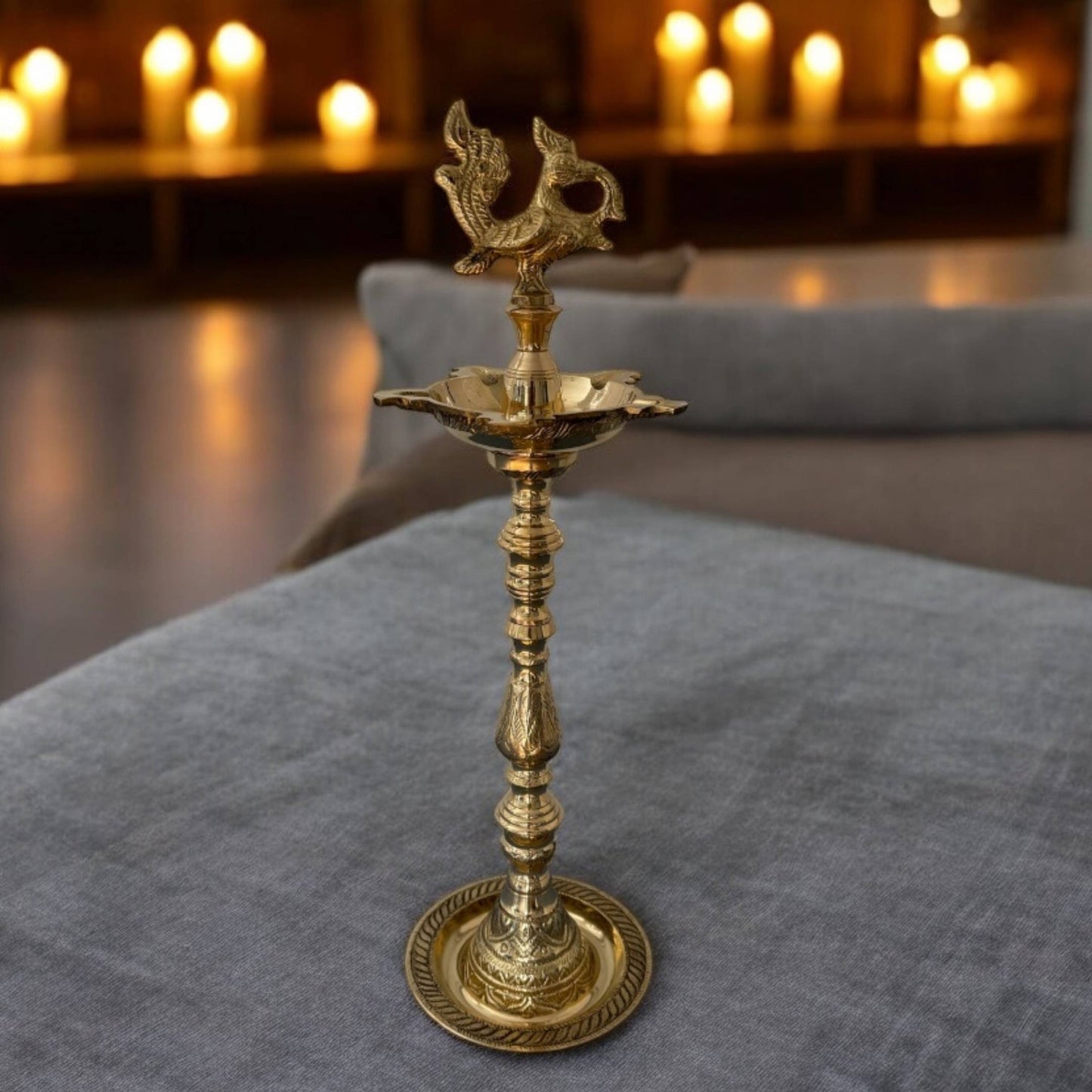 16 Inch tall Brass Mahabharat Diya illuminated, casting a warm glow; perfect brass lamp for enhancing Nilavilakku decor
