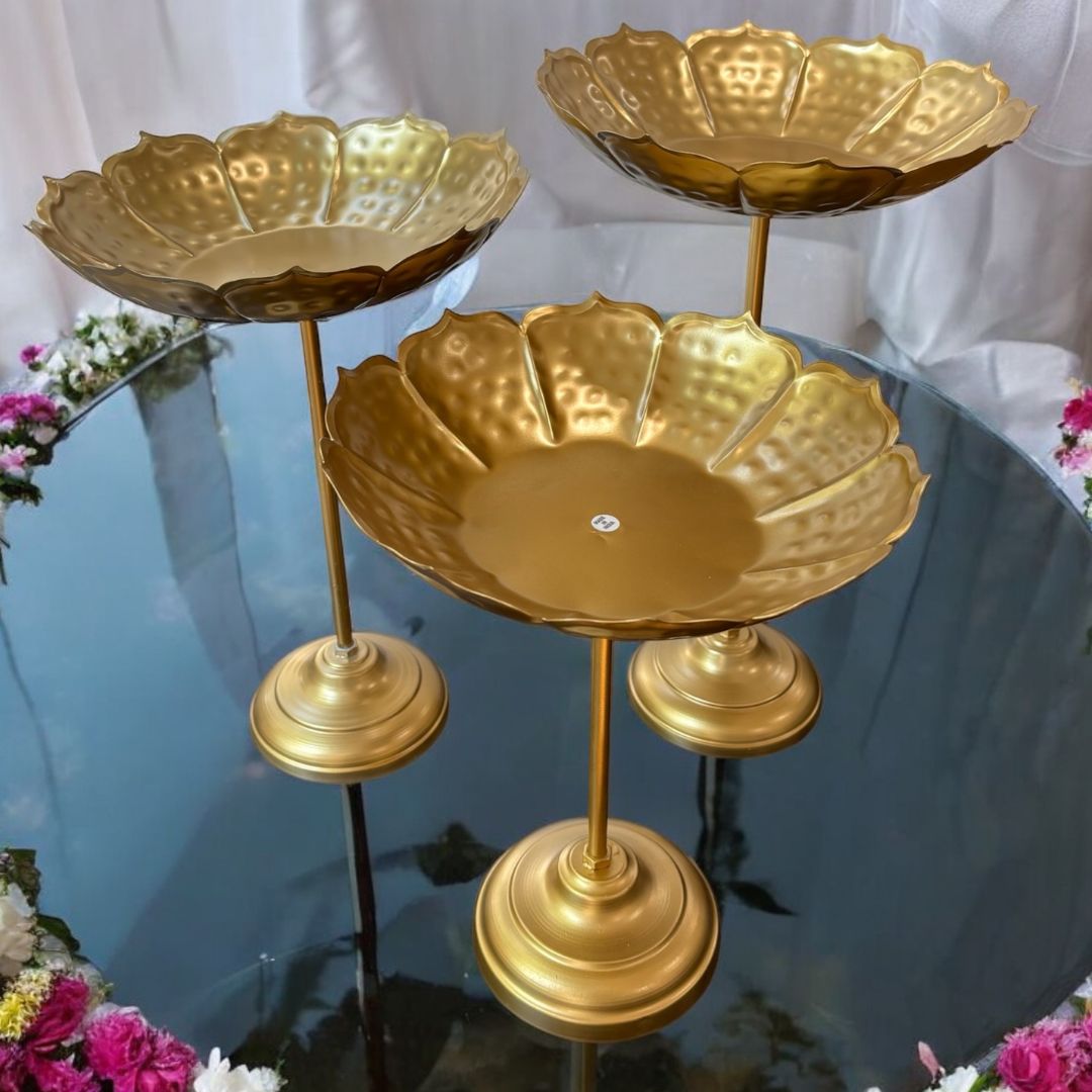 Side‑angle view of all three standing bowls grouped together on a tabletop, emphasizing their tiered arrangement and elegant proportions.