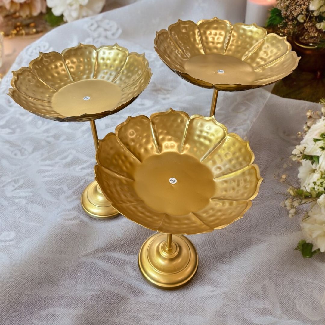 Side‑angle view of all three standing bowls grouped together on a tabletop, emphasizing their tiered arrangement and elegant proportions.