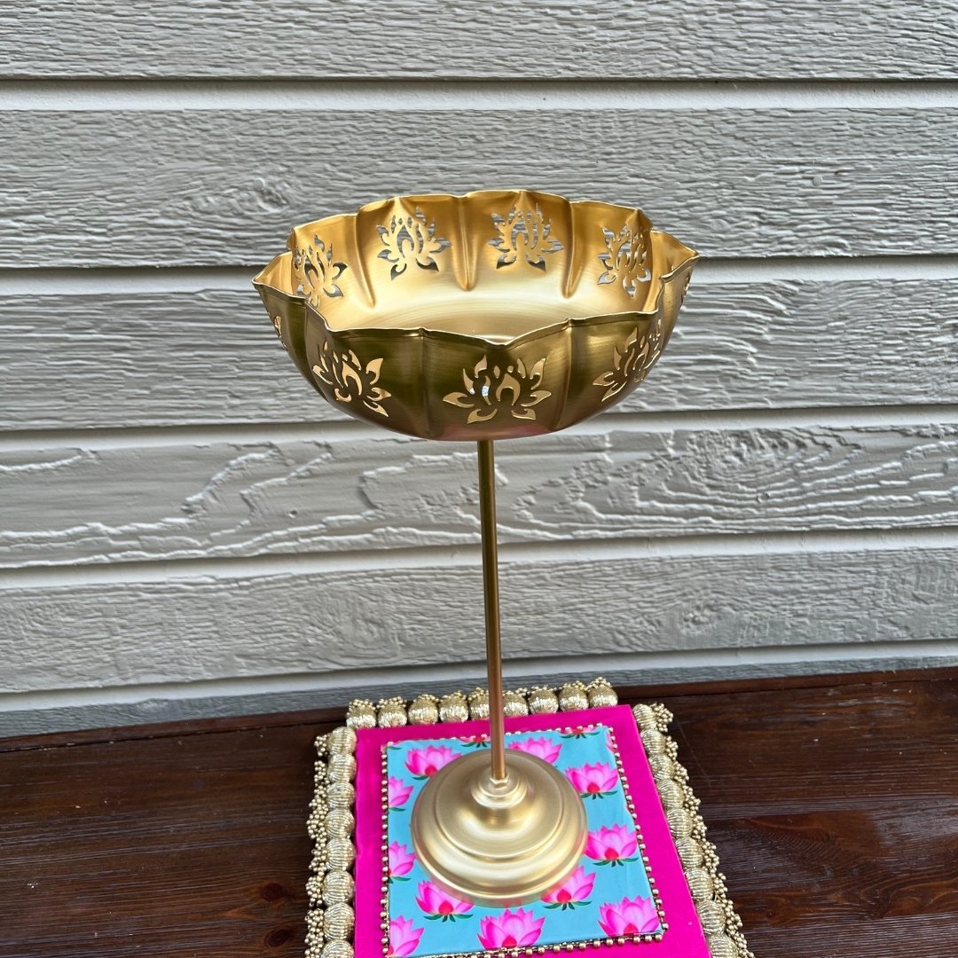 Single Gold Lotus Motif Urli by Urli Utsav Decor styled on decorative mat — ideal indoor puja, tabletop centerpiece for festivals