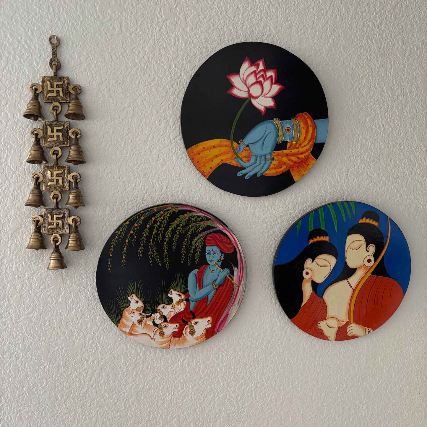 The brass Swastik wall hanging mounted at a home's entrance, exemplifying its role in welcoming positive energy and serving as a housewarming gift