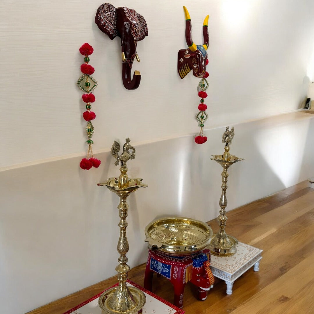 Brass Mahabharat Diya Kuthu Vilakku Diya Oil Lamp featured in a festive arrangement, symbolizing traditional Indian lamp for pooja