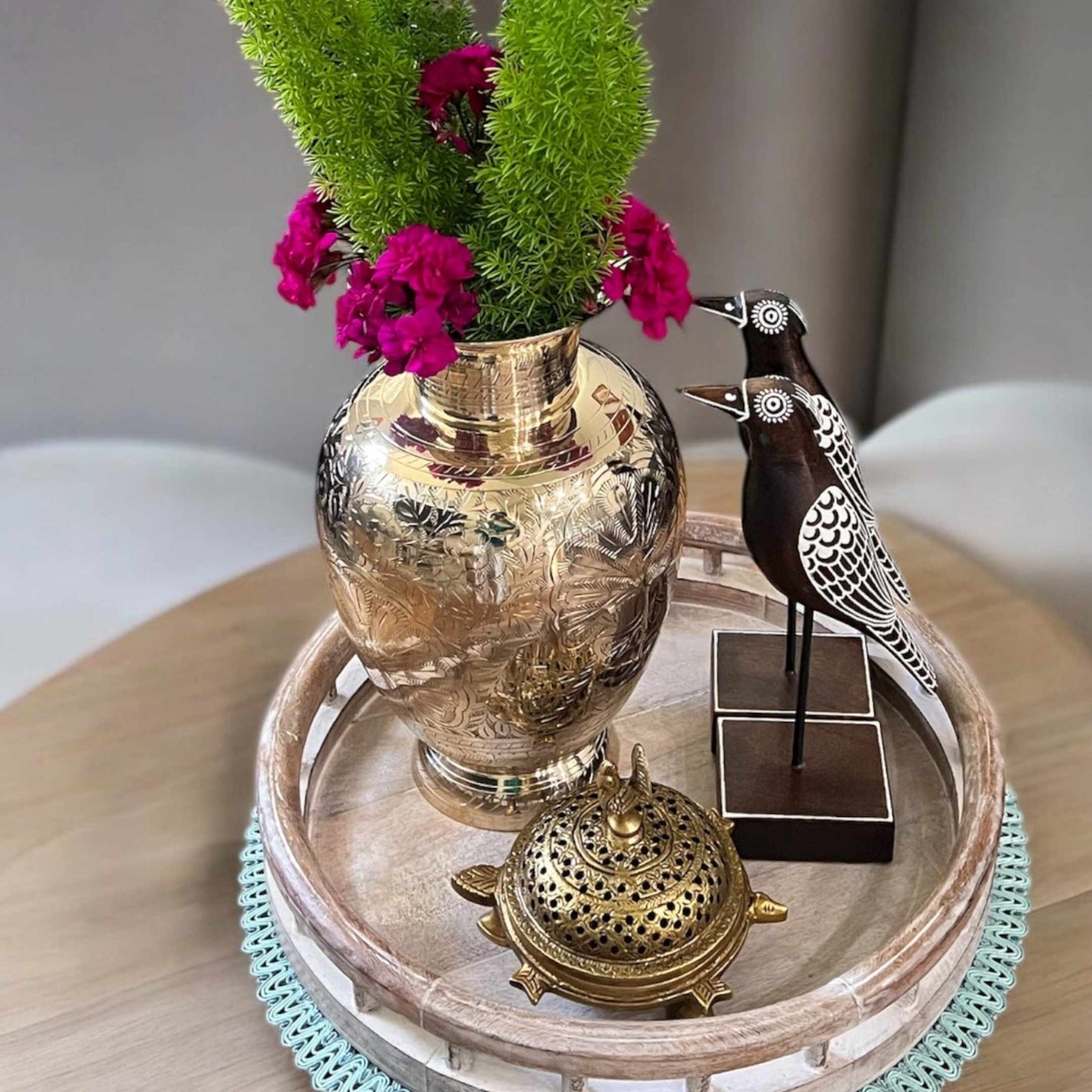 Brass vase displayed alongside complementary decor pieces, enhancing its aesthetic appeal
