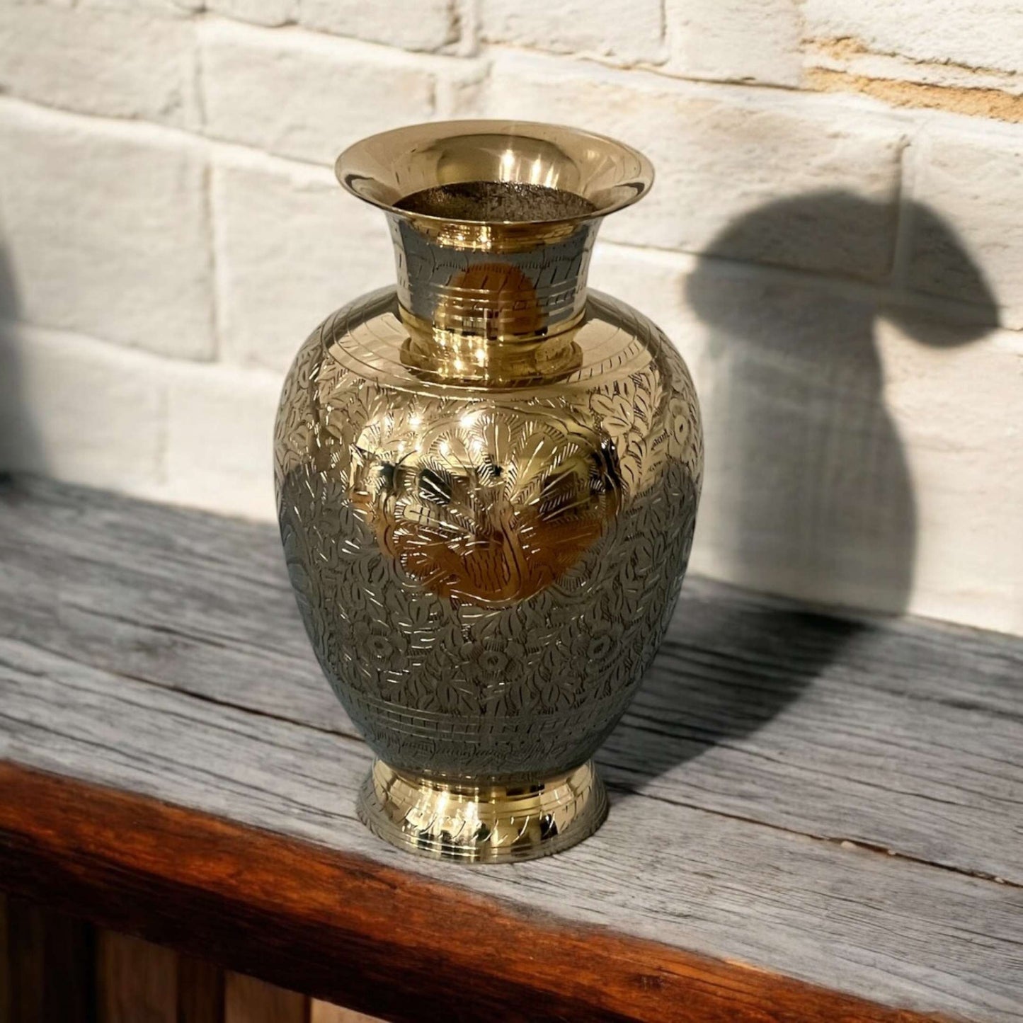 top-down perspective of the brass vase revealing the smooth, circular opening and interior finish