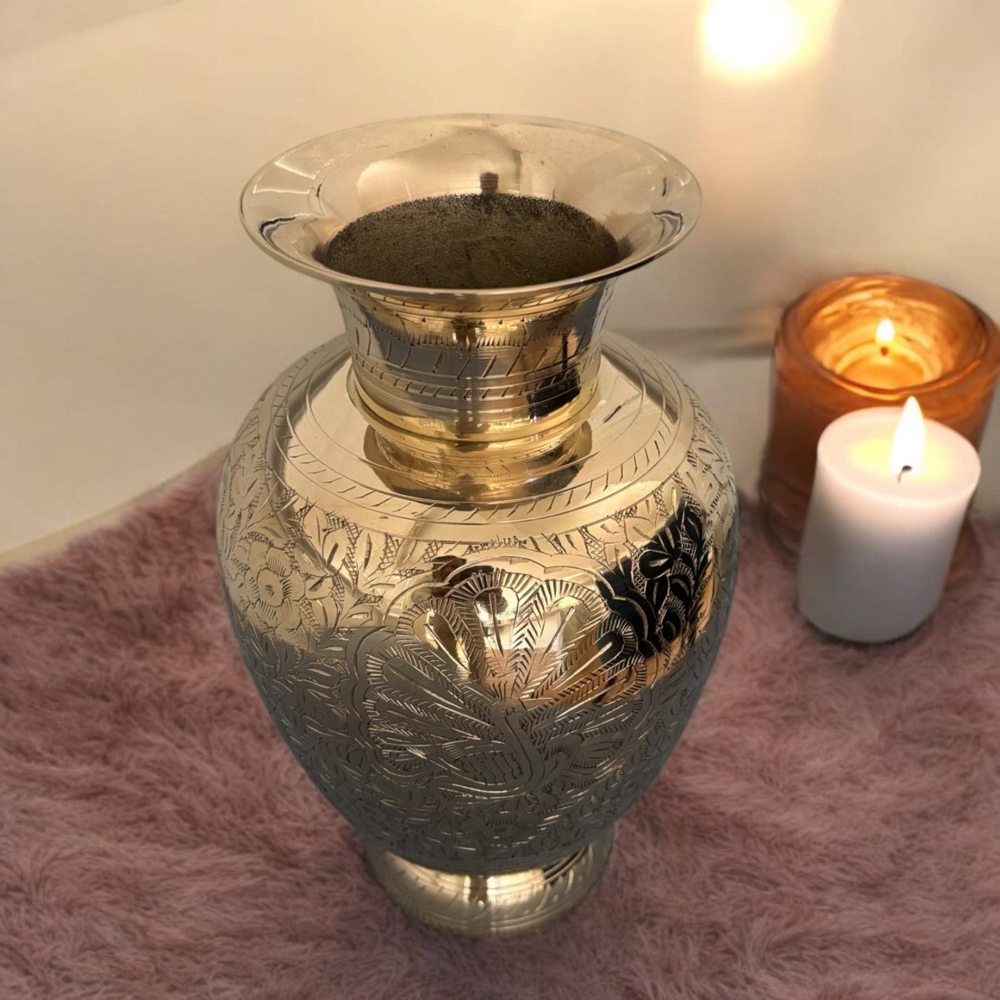 brass vase highlighting the sturdy base and displayed in bed room as table decor