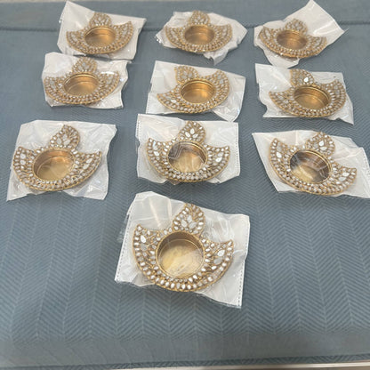 Ten gold mirror deep tea light holders, each in its own clear protective bag, as they ship