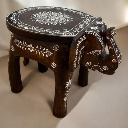 Brown Natural Elephant Stool - Living room furniture, Close-up of intricately carved elephant legs supporting the boho-style wooden side table