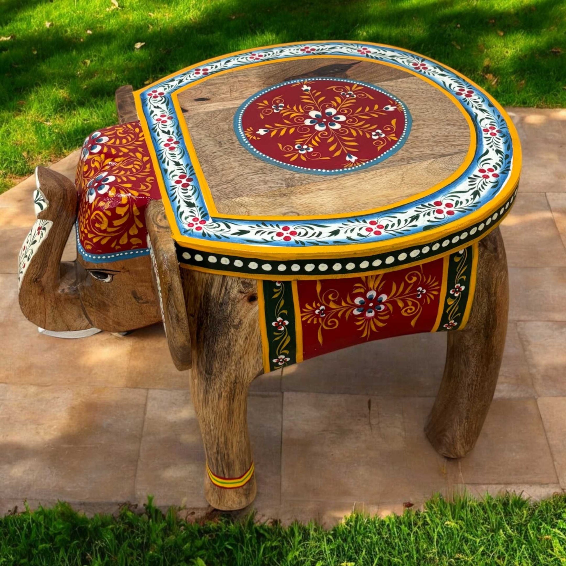 Natural Wood Elephant Stool -ooden elephant stool styled as a coffee table in a cozy living room with modern decor