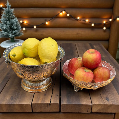Fruit bowl with lemons and apples on wooden table with lights – Urli Utsav centerpiece décor