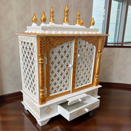 Side angle of white wooden temple mandir with gold accents –  mandir design by urli utsav decor