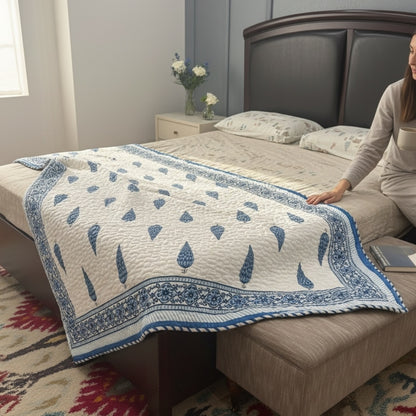Snapdragon floral pattern reversible quilt with delicate botanical hand-block details.