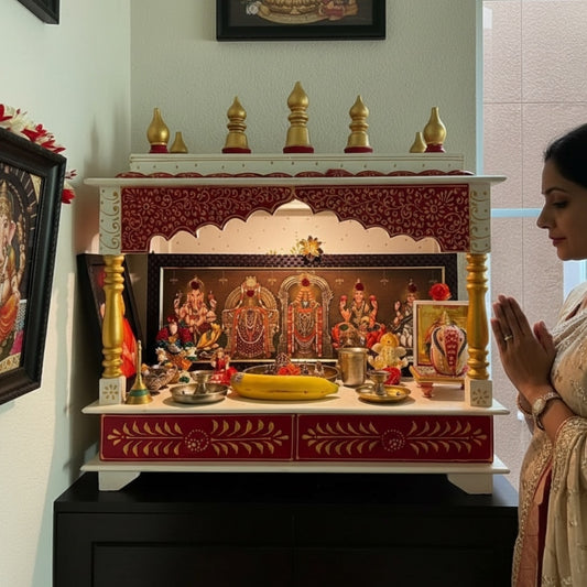 Woman praying at Urli Utsav red and white home mandir, showcasing Indian temple worship setup ideal for daily pooja in USA homes