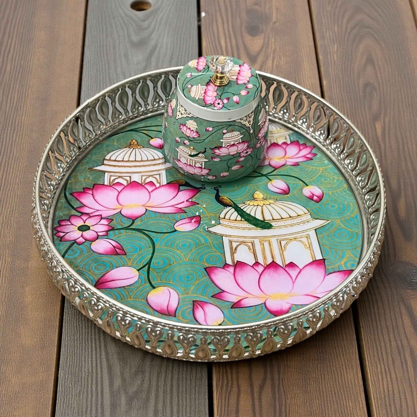 Decorative tray with floral design on a wooden surface