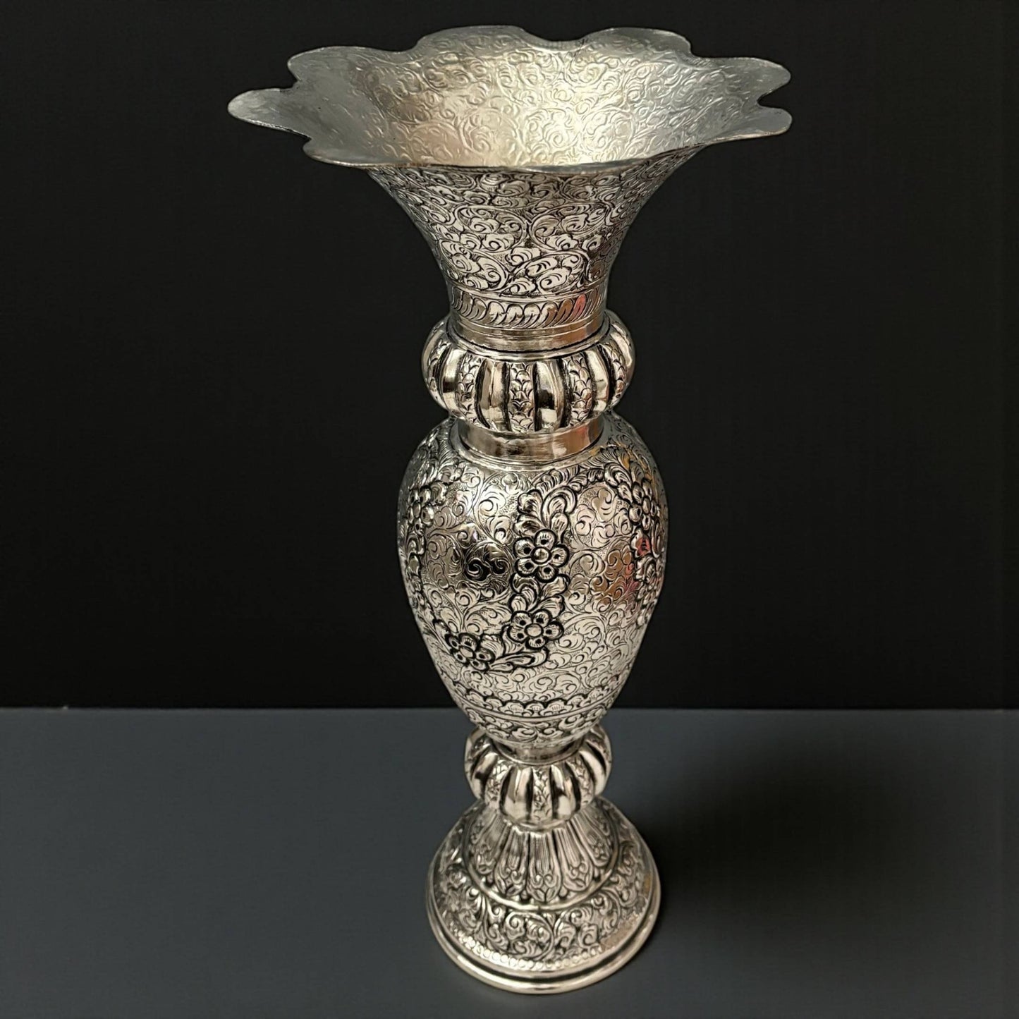 Side view of the Heritage Manor silver-plated brass vase showcasing its elegant silhouette and antique finish for grand entryway decor.