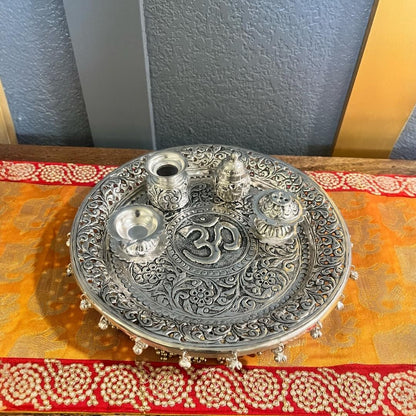 Elegant silver pooja thali set arranged for a spiritual ritual, perfect for Diwali gifting or housewarming celebrations.