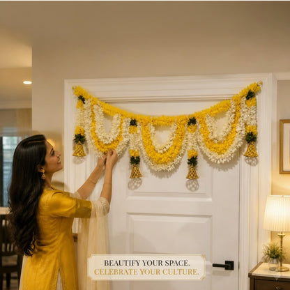 Woman hanging Champa yellow-white marigold toran bandhanwar, beautify your space