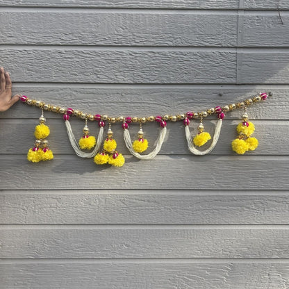 Moti pearl bead toran with gold beads, pink accents and yellow pompom tassels