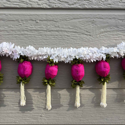 Detailed view of handcrafted artificial jasmine flowers and pink Sola wood lotus buds for festive Indian decor.