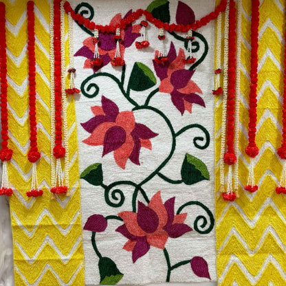 Traditional wedding backdrop showcasing intricate floral and ethnic motifs