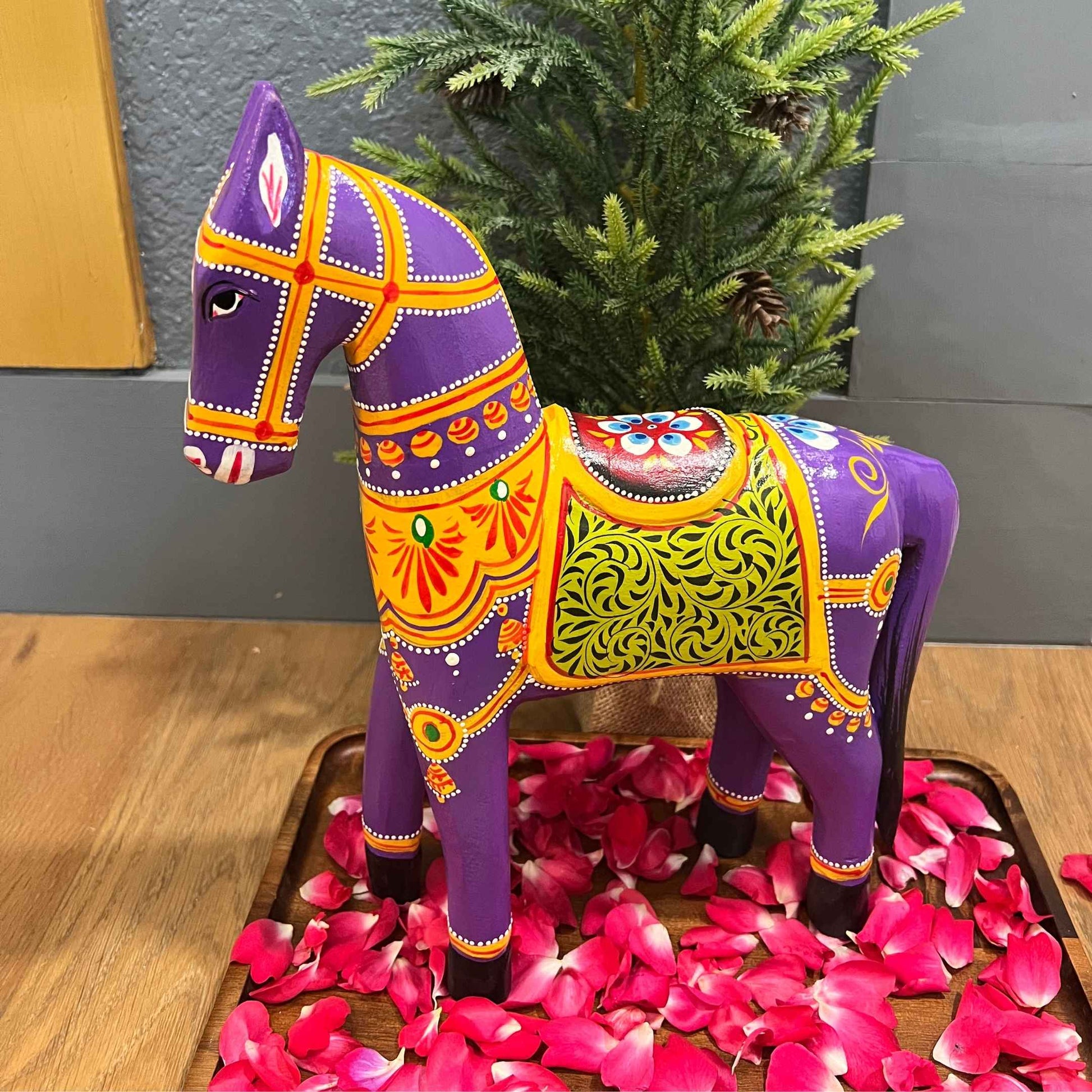 Mango wood purple horse sculpture with a smooth finish and traditional design.
