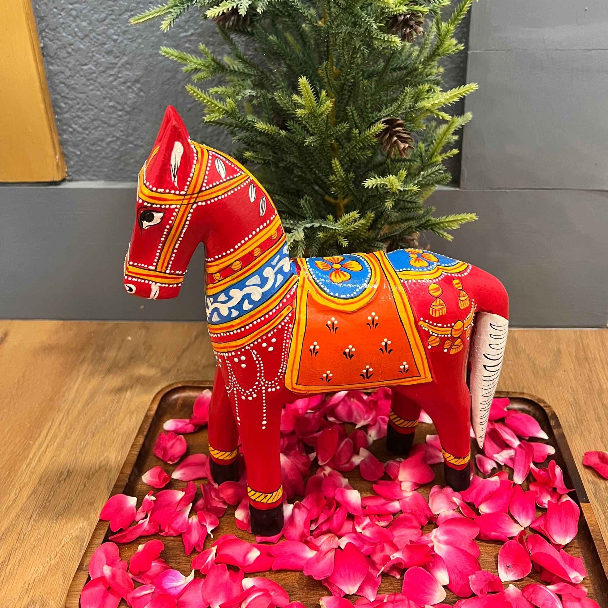Ethnic-style wooden horse figurine, perfect for home decor.