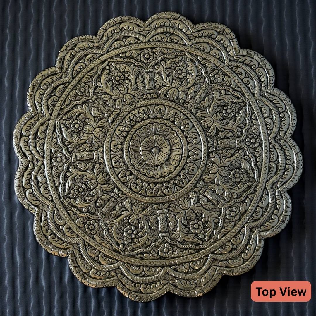 top view - close-up of intricate antique silver carvings and metalwork pattern on wedding pedestal chowki