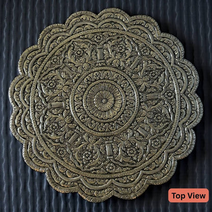 top view - close-up of intricate antique silver carvings and metalwork pattern on wedding pedestal chowki