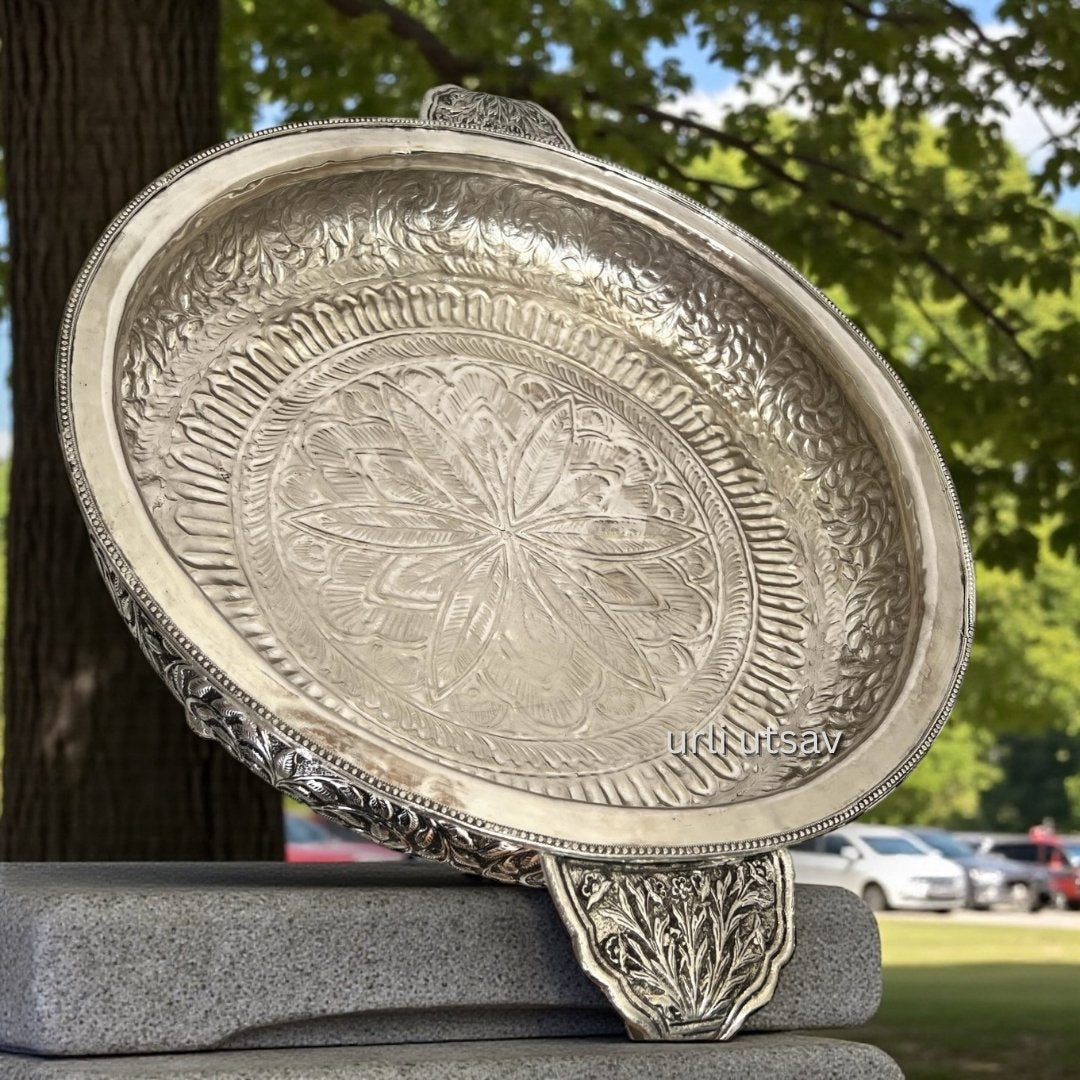 Top view of large silver hand engraved urli bowl showing inner engraving pattern