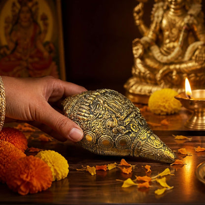 Brass Vishnu Shankh with marigold flowers and diya – sacred conch shell Diwali gift