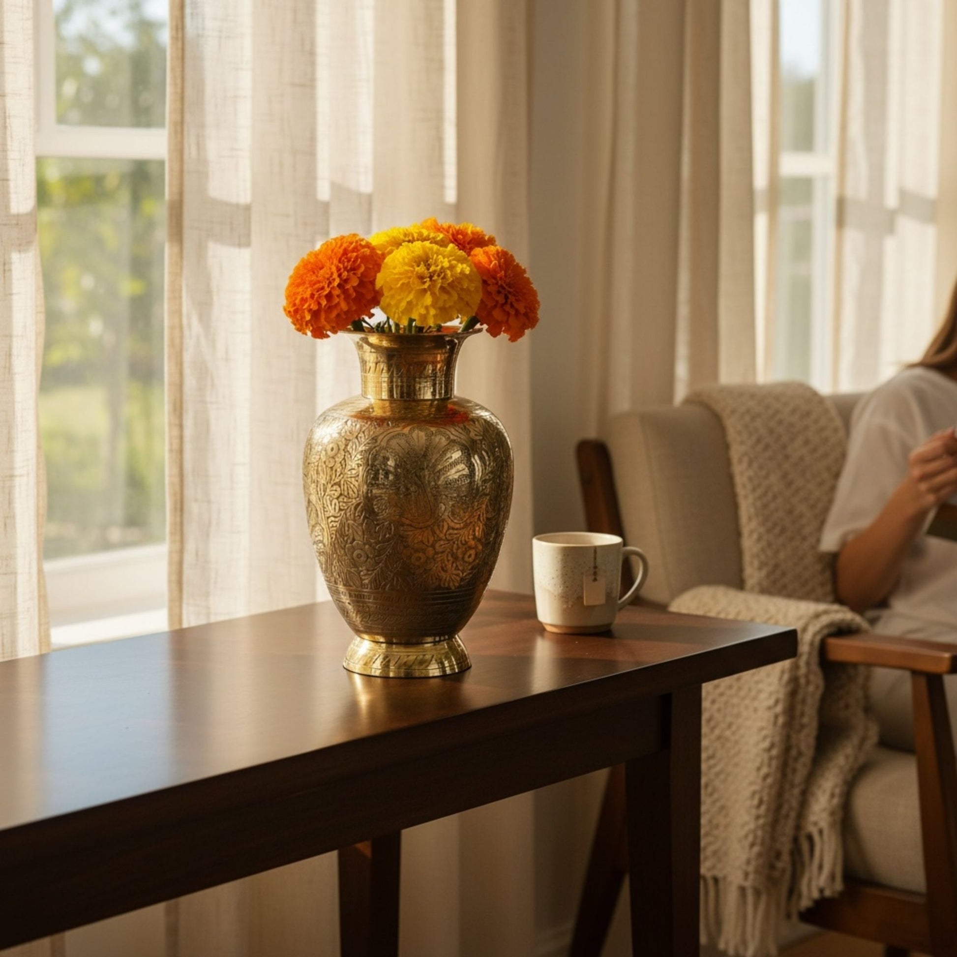 Decorative vase with flowers on a table in a living room setting