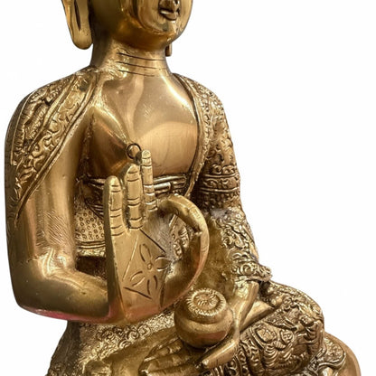 Close-up of 12" Brass Buddha statue showing intricate engraved detailing and vintage finish