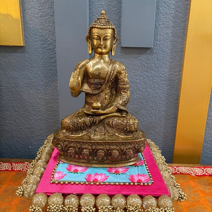 Handcrafted 12" Brass Buddha on decorative platform with blue-pink cushion — meditation decor