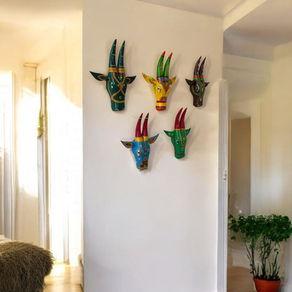 Hand-painted wooden Nandi cow head wall art by Urli Utsav, showcasing intricate ethnic designs in vibrant colors