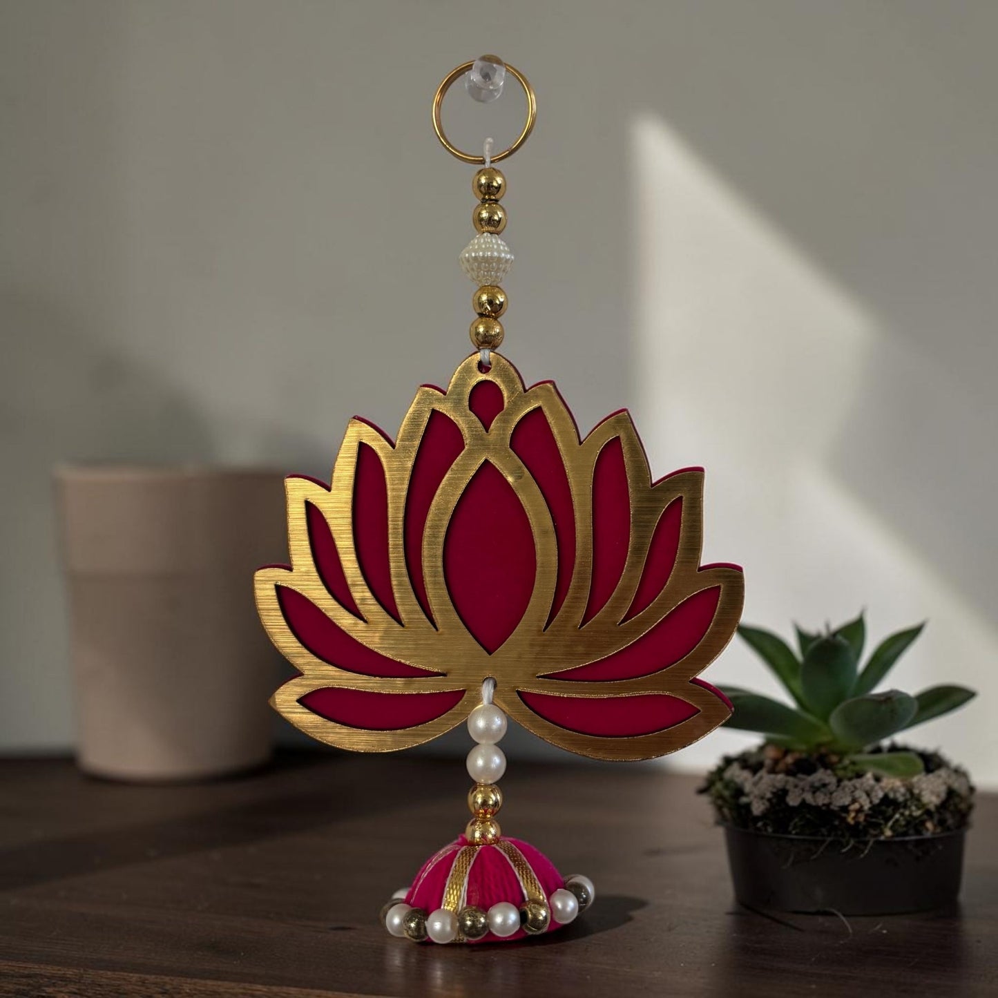 Single short lotus MDF dangler with gold ring, pearl-and-gold bead string and pink tassel — Diwali
