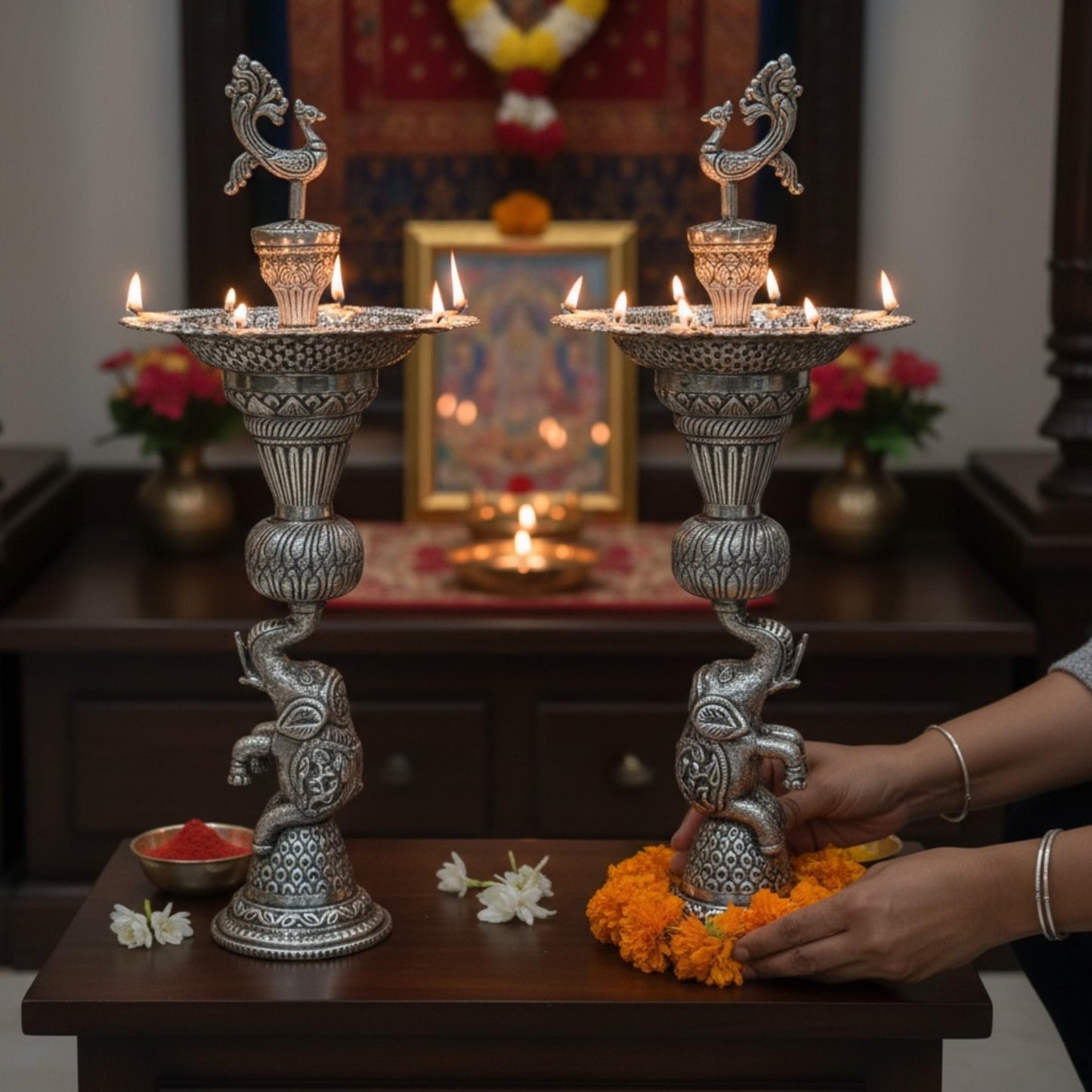 Pair of German silver peacock and elephant base samai oil lamps display