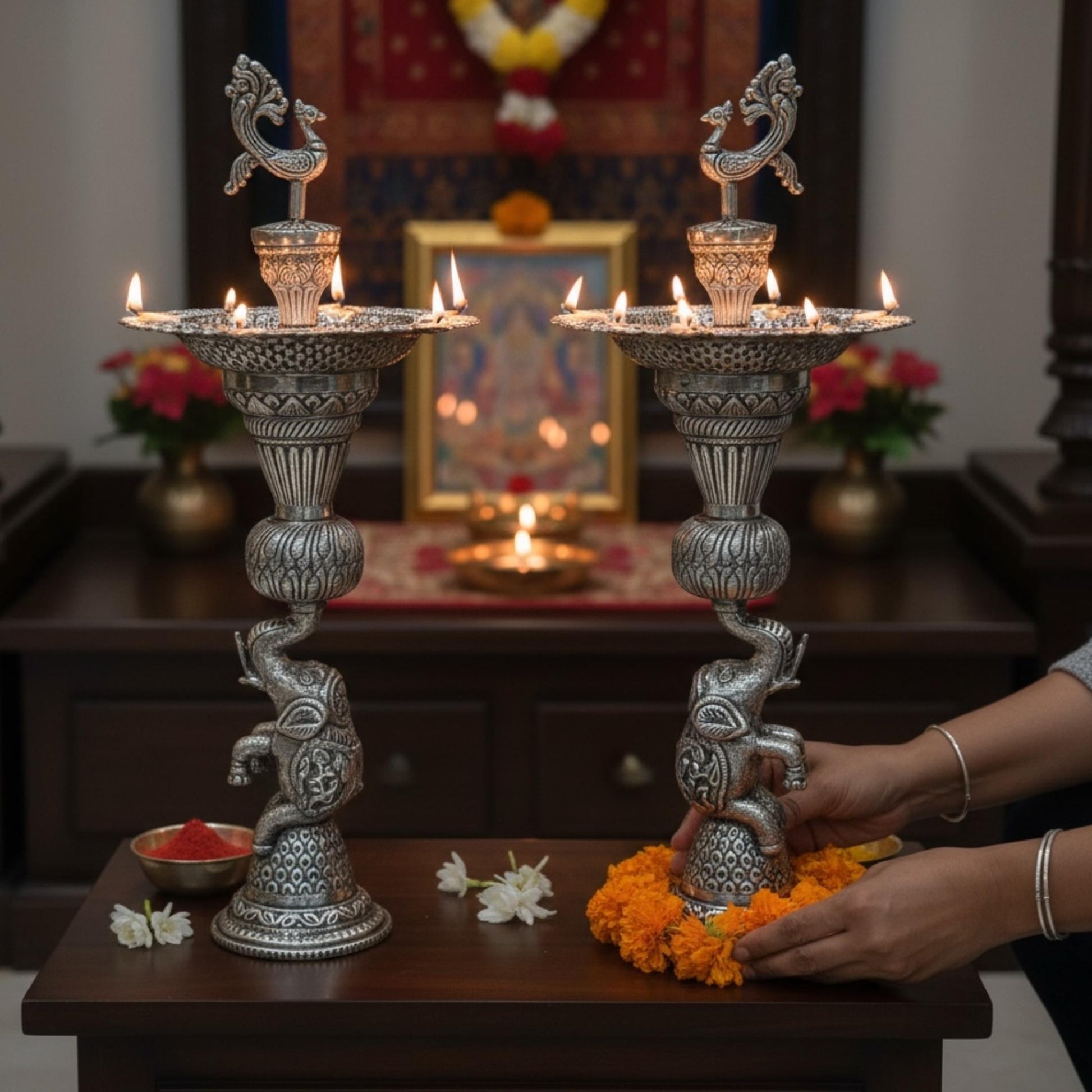 Pair of German silver peacock and elephant base samai oil lamps display