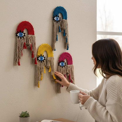 Handcrafted 24 inch blue glass evil eye cotton rope 4 designs wall hanging on white background.