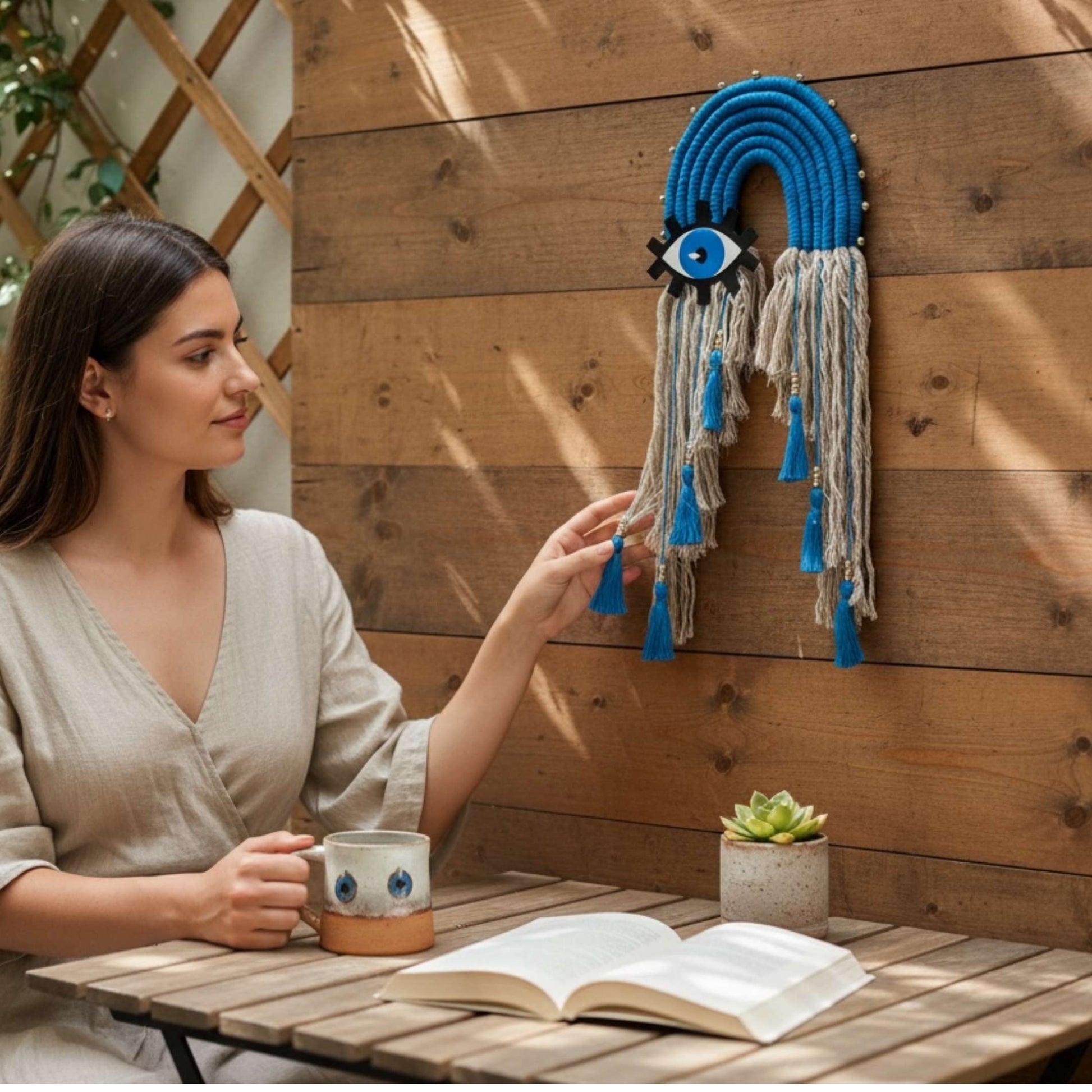 Blue evil eye nazar hanging on a front door for home protection and good luck.