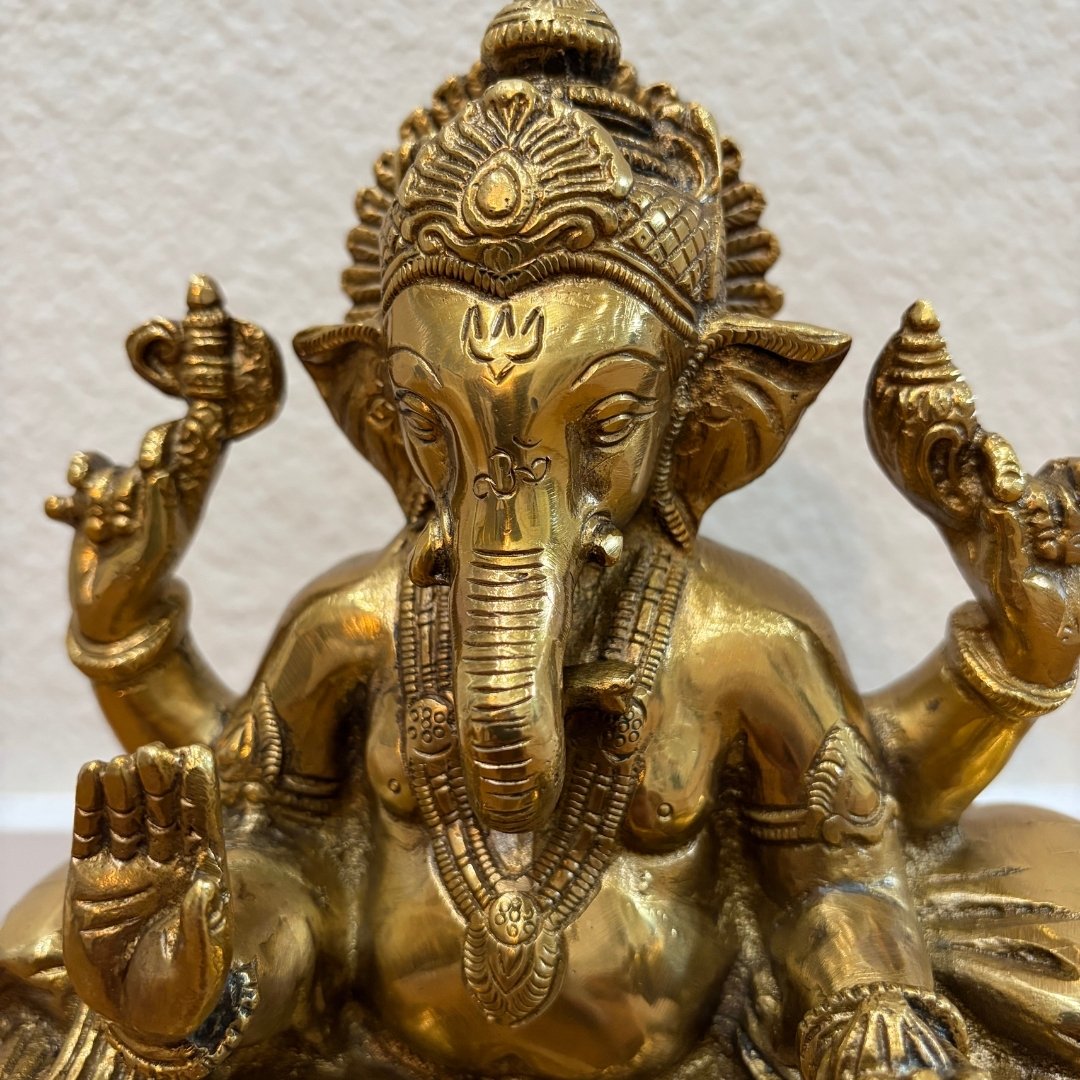 Front view 9.5" Brass Ganpati idol with elephant head and antique gold finish on white background