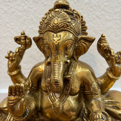 Front view 9.5" Brass Ganpati idol with elephant head and antique gold finish on white background