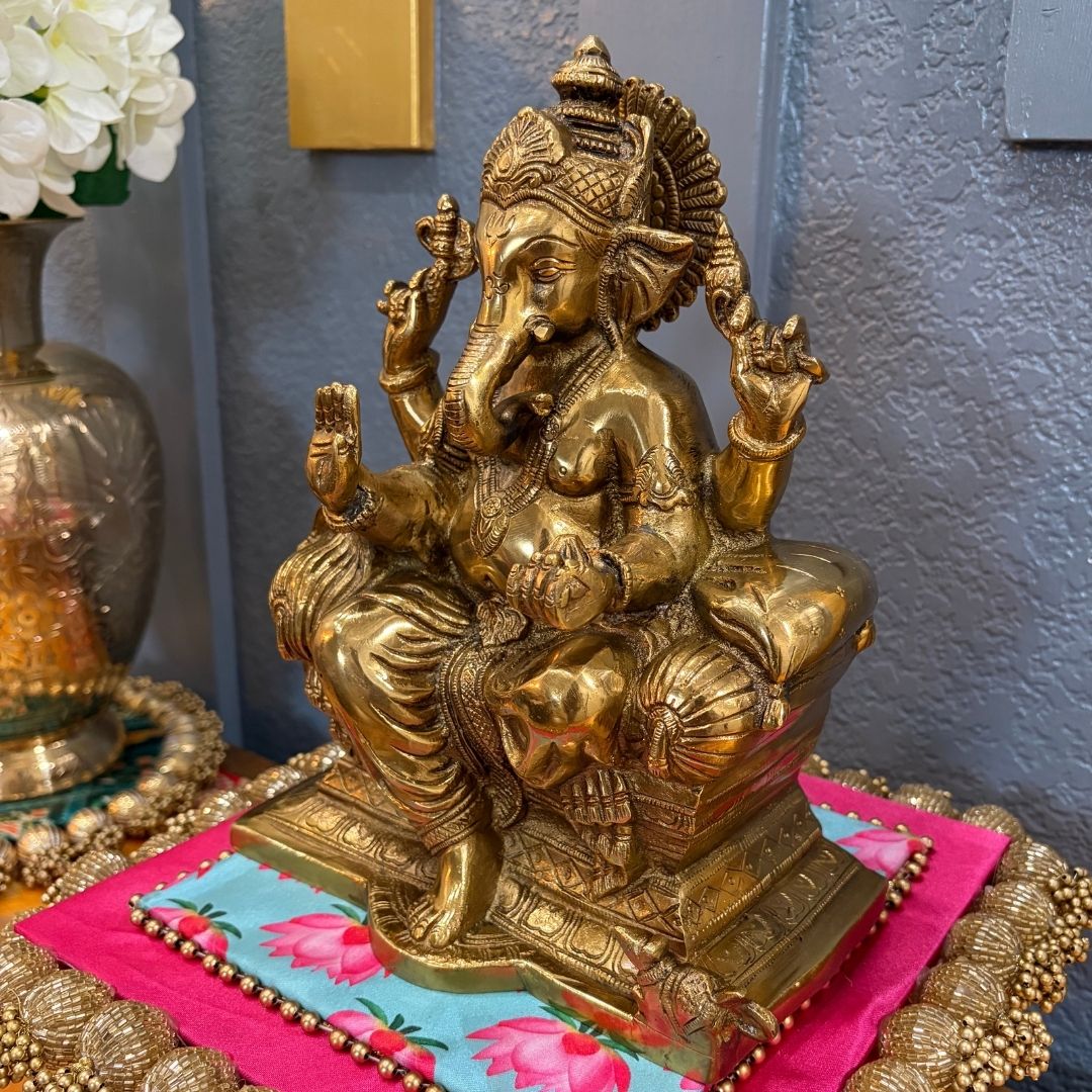 Brass Ganesha on colorful fabric close-up — perfect for Diwali and Ganesh Chaturthi displays