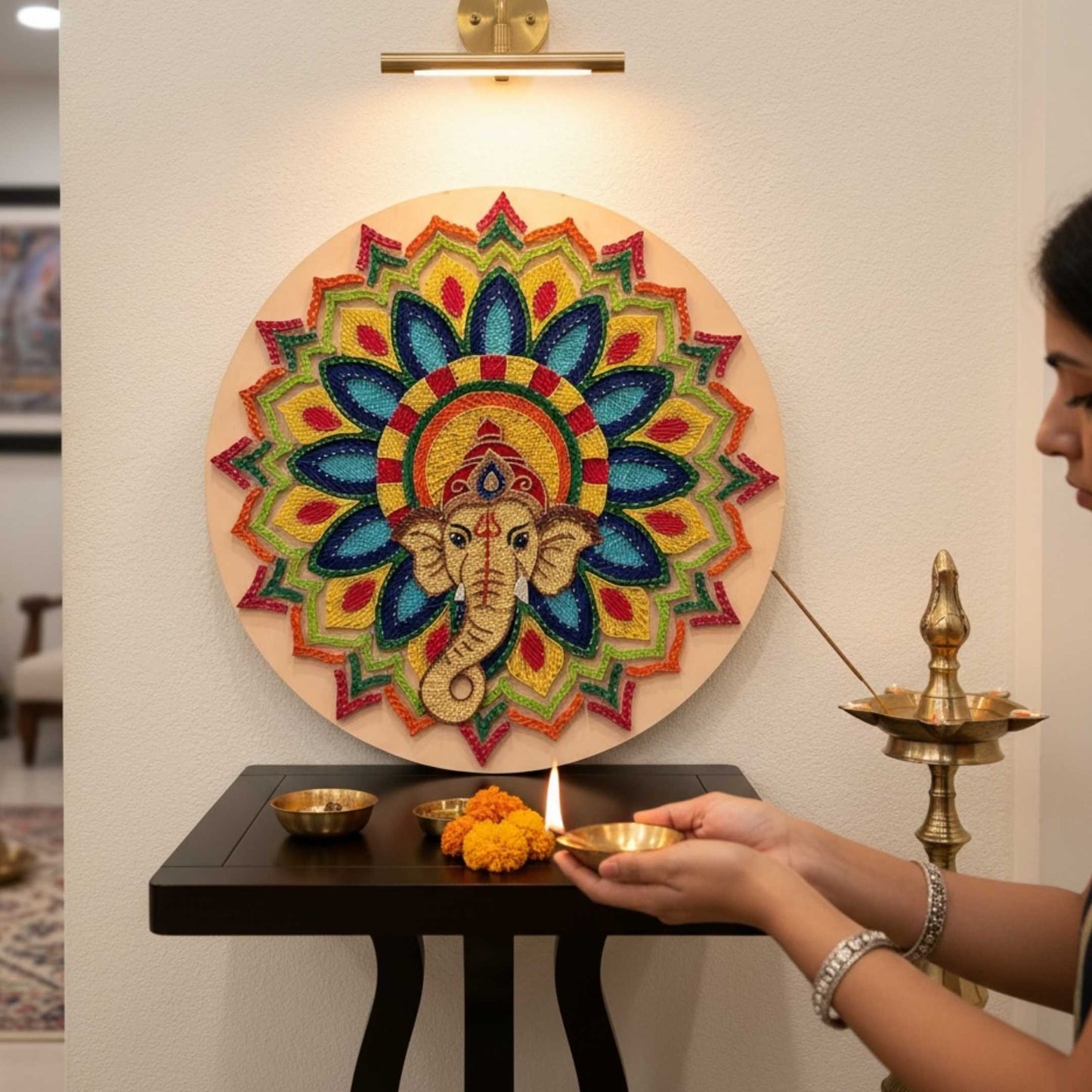 30-inch Ganesha string art wall decor with colorful mandala design and a person performing a ritual.
