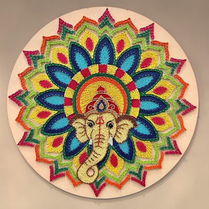 30-inch Ganesha string art wall decor featuring intricate colorful thread work and gold nails on a dark circular MDF board by Urli Utsav.