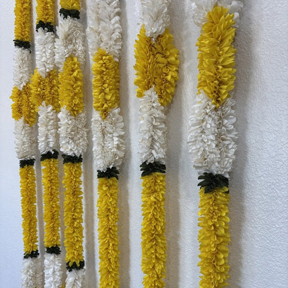 Set of 6 yellow white fabric garlands hung on wall Indian home Diwali decor