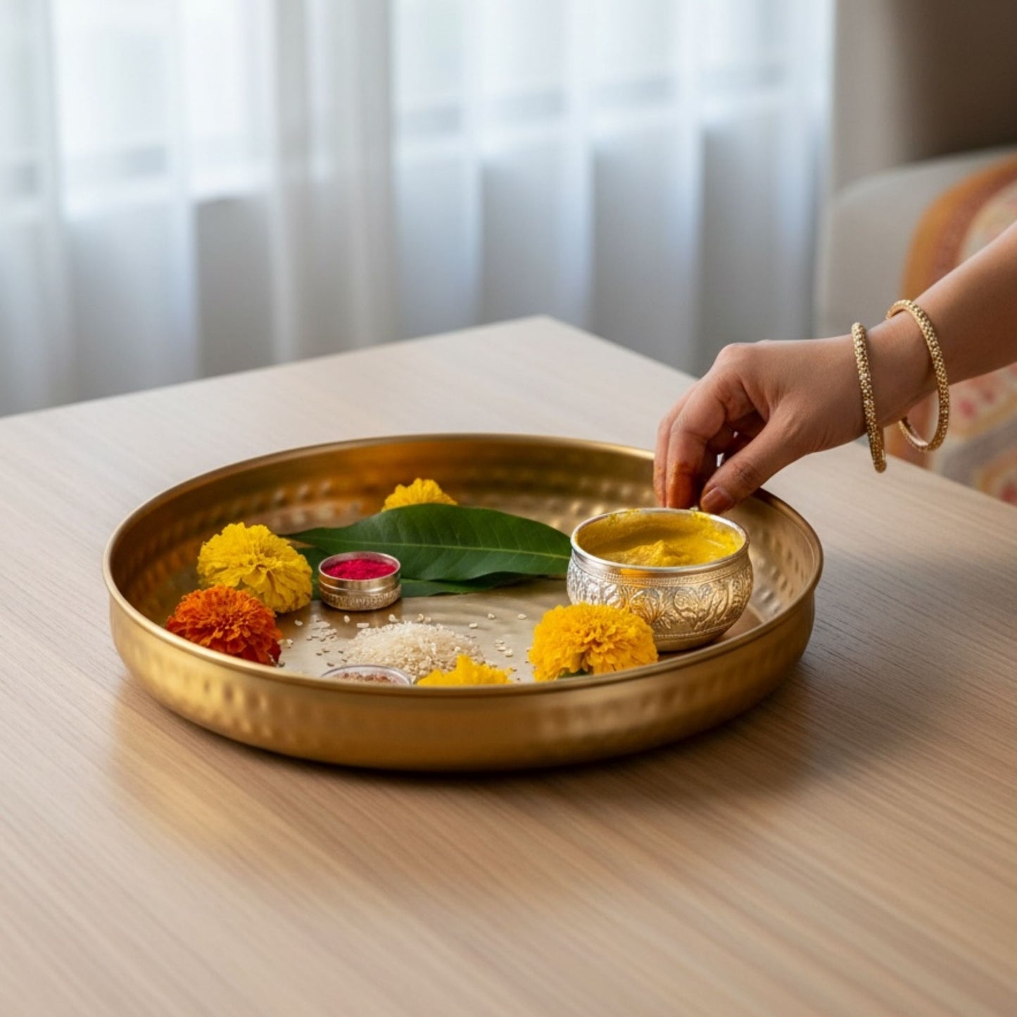 Gold tray with flowers and a small bowl - haldi platter