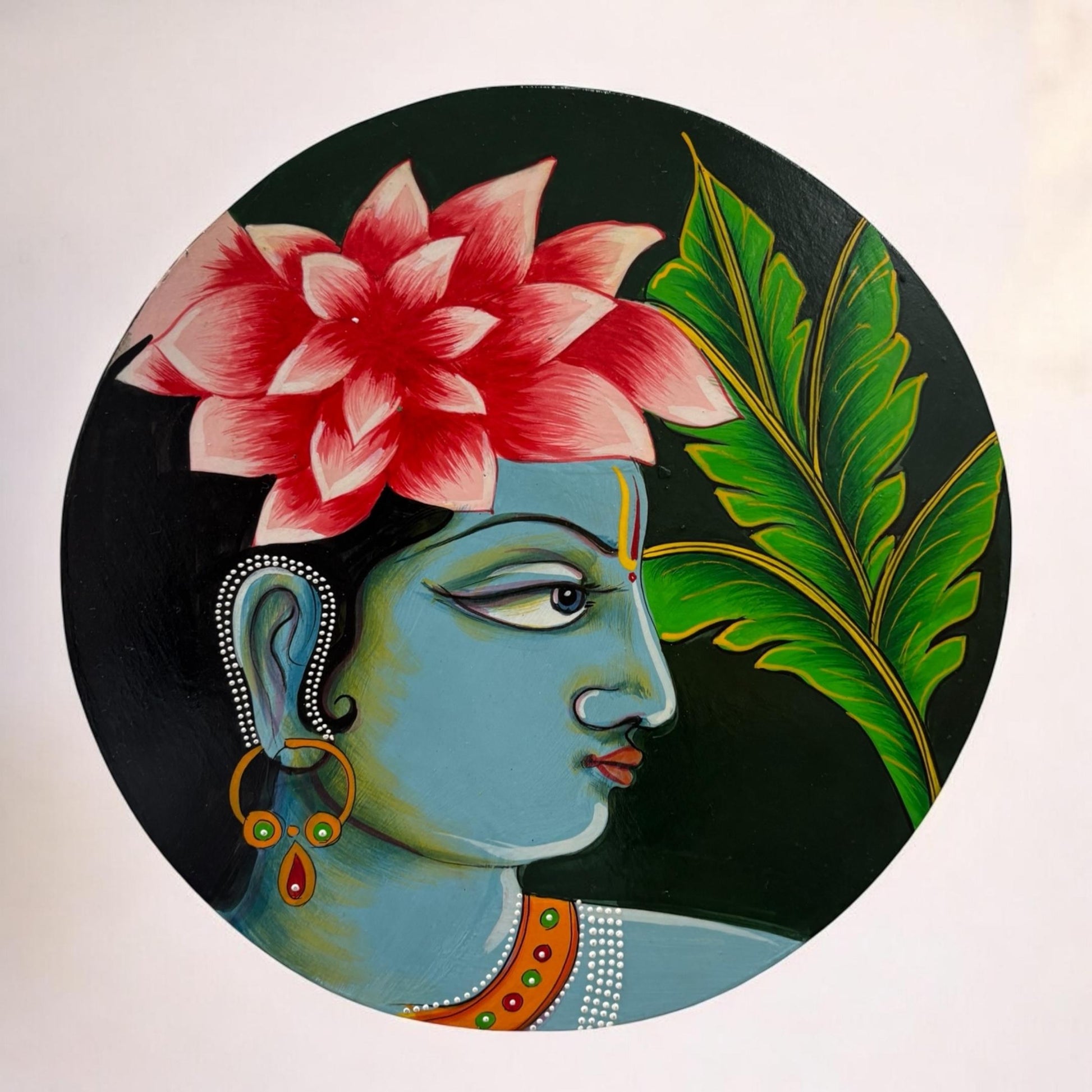 Handpainted Krishna wall plate showcasing Lord Krishna with a peacock feather crown and flute, blending Indian tradition with boho charm