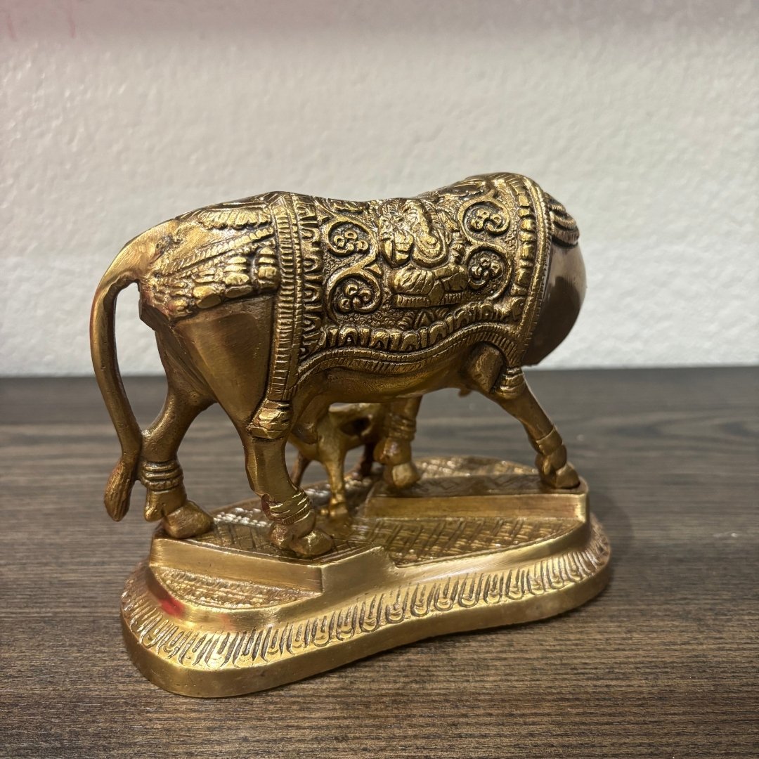 Ornate brass Kamdhenu bull figurine with embossed detailing, Hindu Vastu decor piece