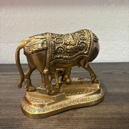 Ornate brass Kamdhenu bull figurine with embossed detailing, Hindu Vastu decor piece