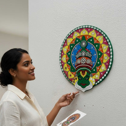 Woman admiring colorful kathakali wall art design on a white wall